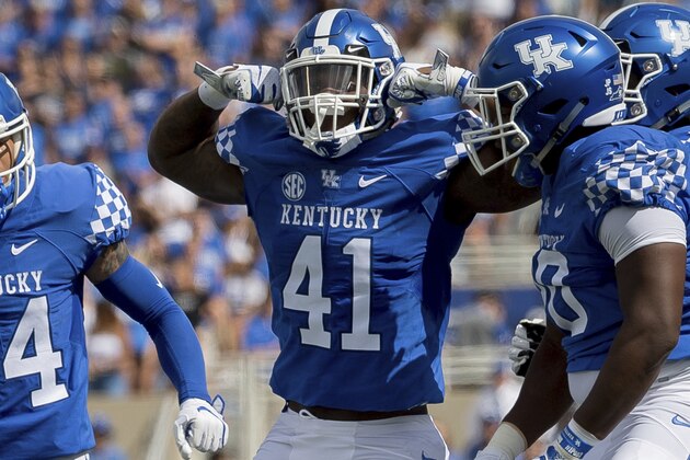 Kentucky linebacker Josh Allen (41), center, and teammates celebrate after tackling Central Michigan running back Jonathan Ward (5) for negative yards in the first half of an NCAA college football game in Lexington, Ky., Saturday, Sept. 1, 2018. (AP Photo/Bryan Woolston)