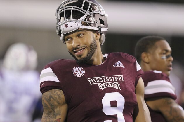 Mississippi State defensive end Montez Sweat (9) smiles while resting during warm-up drills before their NCAA college football game against Louisiana Tech on Saturday, Nov. 3, 2018, in Starkville, Miss. (AP Photo/Jim Lytle)