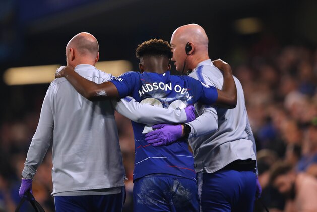 LONDON, ENGLAND - APRIL 22:  Callum Hudson-Odoi of Chelsea is helped off the pitch after sustaining an injury during the Premier League match between Chelsea FC and Burnley FC at Stamford Bridge on April 22, 2019 in London, United Kingdom. (Photo by Warren Little/Getty Images)