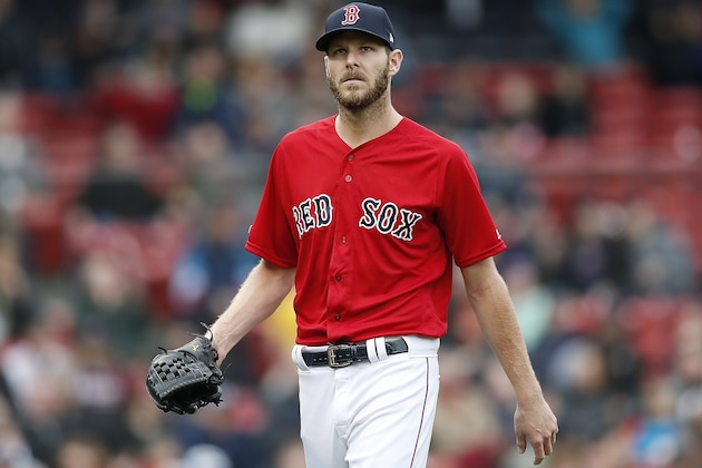 Boston Red Sox's Chris Sale walks to the dugout after pitching during the fourth inning of the first game of a baseball doubleheader against the Detroit Tigers in Boston, Tuesday, April 23, 2019. (AP Photo/Michael Dwyer)