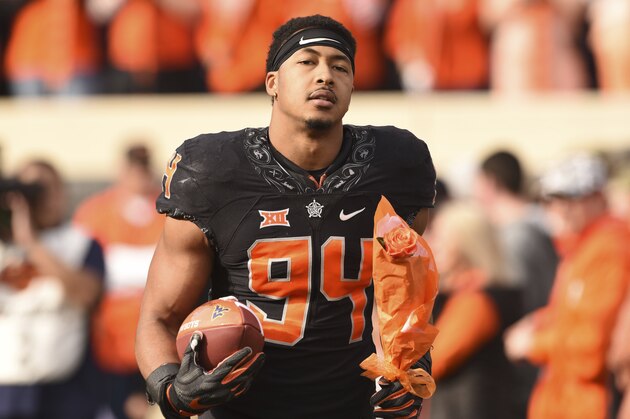 Oklahoma State defensive end Jordan Brailford walks onto the field for senior night prior to an NCAA college football game in Stillwater, Okla., Saturday, Nov. 17, 2018. (AP Photo/Brody Schmidt)