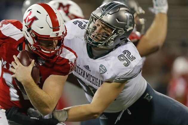 OXFORD, OH - NOVEMBER 15:  Maxx Crosby #92 of the Eastern Michigan Eagles sacks Gus Ragland #14 of the Miami Ohio Redhawks during the second half at Yager Stadium on November 15, 2017 in Oxford, Ohio.  (Photo by Michael Reaves/Getty Images)