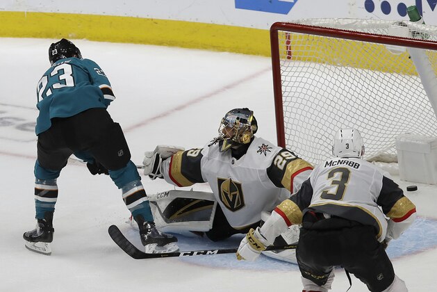 San Jose Sharks right wing Barclay Goodrow, left, scores a goal past Vegas Golden Knights goaltender Marc-Andre Fleury (29) during overtime of Game 7 of an NHL hockey first-round playoff series in San Jose, Calif., Tuesday, April 23, 2019. The Sharks won 5-4. (AP Photo/Jeff Chiu)