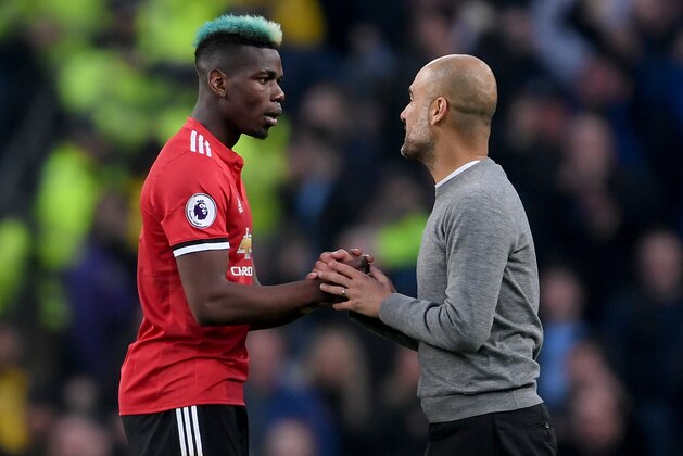 MANCHESTER, ENGLAND - APRIL 07:  Paul Pogba of Manchester United speaks with Josep Guardiola, Manager of Manchester City after the Premier League match between Manchester City and Manchester United at Etihad Stadium on April 7, 2018 in Manchester, England.  (Photo by Laurence Griffiths/Getty Images)