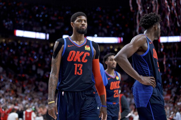 Oklahoma City Thunder forward Paul George, left, and forward Jerami Grant walk off the court after losing to the Portland Trail Blazers in Game 5 of an NBA basketball first-round playoff series, Tuesday, April 23, 2019, in Portland, Ore. The Trail Blazers won 118-115. (AP Photo/Craig Mitchelldyer)