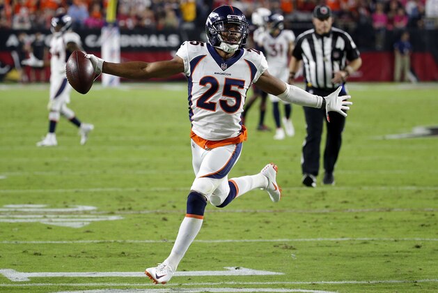 FILE- In this Oct. 18, 2018, file Denver Broncos cornerback Chris Harris Jr. (25) celebrates his interception for a touchdown against the Arizona Cardinals during the first half of an NFL football game in Glendale, Ariz. When they take the field Sunday, Nov. 25, Harris will have waited 1,072 days for his rematch with Pittsburgh Steelers receiver Antonio Brown. (AP Photo/Rick Scuteri, File)