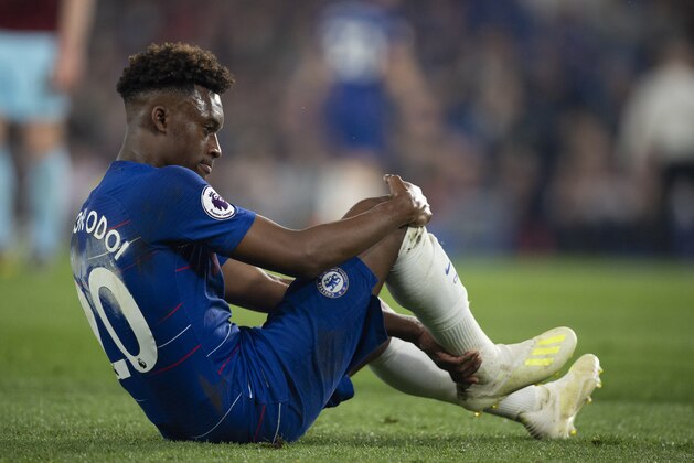LONDON, ENGLAND - APRIL 22: Callum Hudson-Odoi of Chelsea feels his right achilles after falling to the ground during the Premier League match between Chelsea FC and Burnley FC at Stamford Bridge on April 22, 2019 in London, United Kingdom. (Photo by Visionhaus/Getty Images)