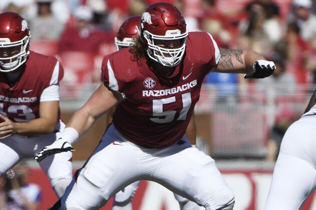 Arkansas offensive lineman Hjalte Froholdt gets ready to run a play against Tulsa in the first half of an NCAA college football game Saturday, Oct. 20, 2018, in Fayetteville, Ark. (AP Photo/Michael Woods)