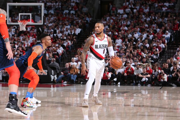 PORTLAND, OR - APRIL 23: Damian Lillard #0 of the Portland Trail Blazers handles the ball against Russell Westbrook #0 of the Oklahoma City Thunder  during Game Five Round One of the 2019 NBA Playoffs on April 23, 2019 at the Moda Center in Portland, Oregon. NOTE TO USER: User expressly acknowledges and agrees that, by downloading and or using this Photograph, user is consenting to the terms and conditions of the Getty Images License Agreement. Mandatory Copyright Notice: Copyright 2019 NBAE (Photo by Sam Forencich/NBAE via Getty Images)