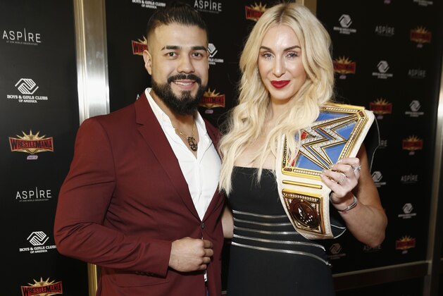NEW YORK, NEW YORK - APRIL 05: WWE Superstars Andrade and Charlotte Flair attend the WWE Superstars For Hope Reception on April 05, 2019 in New York City. (Photo by Brian Ach/Getty Images for WWE)