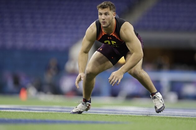 Ohio State defensive lineman Nick Bosa runs a drill during the NFL football scouting combine, Sunday, March 3, 2019, in Indianapolis. (AP Photo/Darron Cummings)