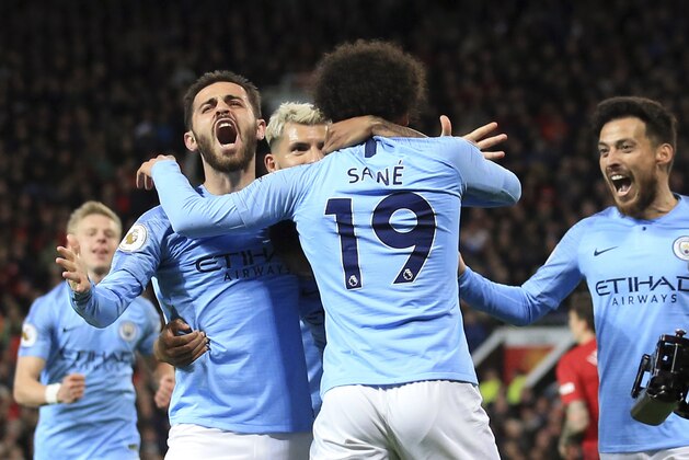 Manchester City's Leroy Sane, 2nd right, celebrates after scoring his side's second goal during the English Premier League soccer match between Manchester United and Manchester City at Old Trafford Stadium in Manchester, England, Wednesday April 24, 2019. (AP Photo/Jon Super)