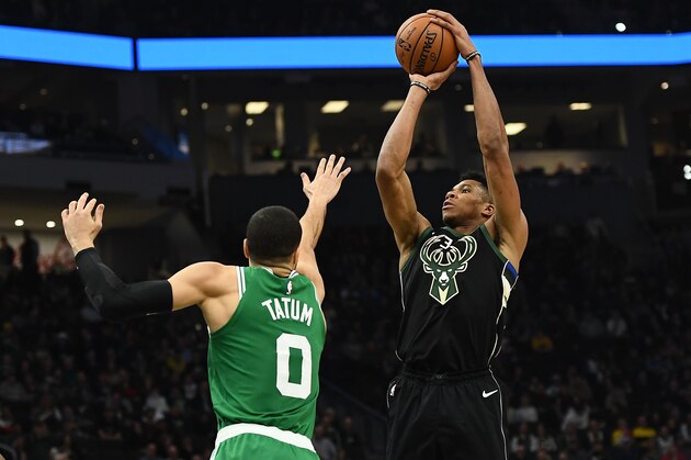 MILWAUKEE, WISCONSIN - FEBRUARY 21:  Giannis Antetokounmpo #34 of the Milwaukee Bucks shoots over Jayson Tatum #0 of the Boston Celtics during a game at Fiserv Forum on February 21, 2019 in Milwaukee, Wisconsin. NOTE TO USER: User expressly acknowledges and agrees that, by downloading and or using this photograph, User is consenting to the terms and conditions of the Getty Images License Agreement. (Photo by Stacy Revere/Getty Images)