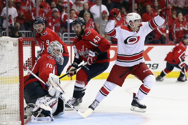 WASHINGTON, DC - APRIL 24: Brock McGinn #23 of the Carolina Hurricanes scores the game winning goal against Braden Holtby #70 of the Washington Capitals at 11:05 of the second overime period in Game Seven of the Eastern Conference First Round during the 2019 NHL Stanley Cup Playoffs at the Capital One Arena on April 24, 2019 in Washington, DC. The Hurricanes defeated the Capitals 4-3 in the second overtime period to move on to Round Two of the Stanley Cup playoffs. (Photo by Patrick Smith/Getty Images)