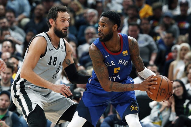 Denver Nuggets guard Will Barton (5) is defended by San Antonio Spurs guard Marco Belinelli (18) in the first half of Game 5 of an NBA basketball first round playoff series, Tuesday, April 23, 2019, in Denver. (AP Photo/David Zalubowski)