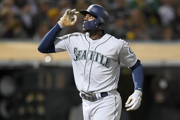 OAKLAND, CA - AUGUST 14:  Cameron Maybin #10 of the Seattle Mariners celebrates after hitting a solo home run against the Oakland Athletics in the top of the fifth inning at Oakland Alameda Coliseum on August 14, 2018 in Oakland, California.  (Photo by Thearon W. Henderson/Getty Images)