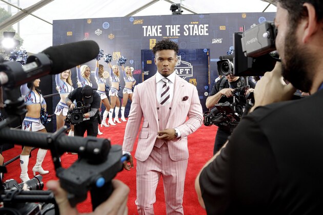 Oklahoma quarterback Kyler Murray walks the red carpet ahead of the first round at the NFL football draft, Thursday, April 25, 2019, in Nashville, Tenn. (AP Photo/Steve Helber)