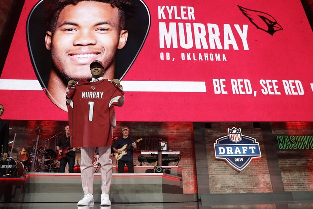 Oklahoma quarterback Kyler Murray shows off his new jersey after the Arizona Cardinals selected Murray in the first round at the NFL football draft, Thursday, April 25, 2019, in Nashville, Tenn. (AP Photo/Mark Humphrey)