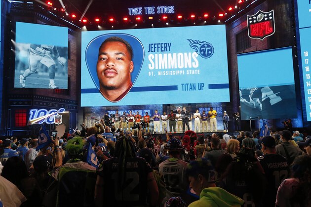 Tennessee high school football players join NFL Commissioner Roger Goodell as Goodell announces that the Tennessee Titans selected Mississippi State's Jeffery Simmons during the first round at the NFL football draft, Thursday, April 25, 2019, in Nashville, Tenn. (AP Photo/Steve Helber)