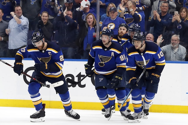 St. Louis Blues' Alex Pietrangelo (27), Vladimir Tarasenko (91) and Brayden Schenn (10) skate back to the bench after celebrating a goal by Tarasenko against the Dallas Stars during the second period in Game 1 of an NHL second-round hockey playoff series Thursday, April 25, 2019, in St. Louis. (AP Photo/Jeff Roberson)