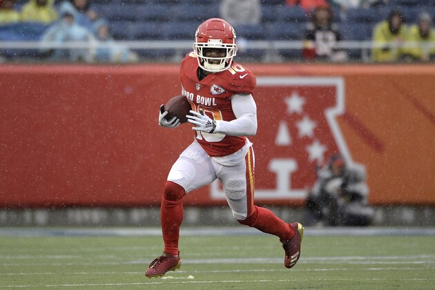 AFC receiver Tyreek Hill (10), of the Kansas City Chiefs, runs for yardage during the first half of the NFL Pro Bowl football game against the NFC Sunday, Jan. 27, 2019, in Orlando, Fla. (AP Photo/Phelan M. Ebenhack)