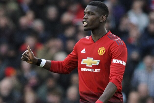 Manchester United's Paul Pogba gestures after scoring his side's second goal during the English Premier League soccer match between Manchester United and West Ham United at Old Trafford in Manchester, England, Saturday, April 13, 2019. (AP Photo/Rui Vieira)