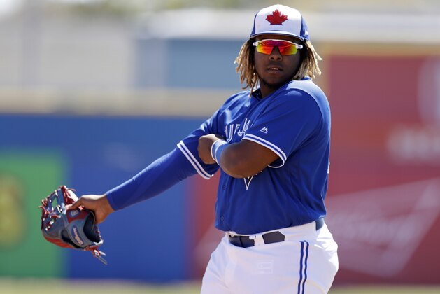 FILE - In this March 6, 2019, file photo, Toronto Blue Jays third baseman Vladimir Guerrero Jr. watches during the second inning of a spring training baseball game against the Philadelphia Phillies in Dunedin, Fla. The Blue Jays top prospect says he feels ready to finally make the jump to the majors, while adding the decision is out of his control. Blue Jays assistant general manager Joe Sheehan said this week the team is still evaluating when to make the move. (AP Photo/Chris O'Meara, File)