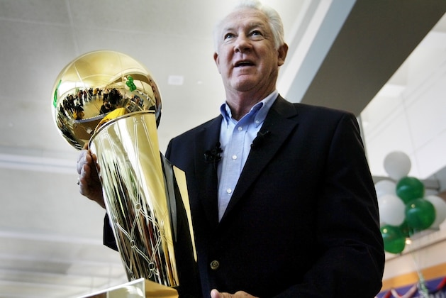 FILE - In this Wednesday, June 4, 2008 file photo, NBA legend John Havlicek holds the Larry O'Brien NBA Championship Trophy at Manchester Boston Regional Airport in Manchester, N.H. The Boston Celtics say Hall of Famer John Havlicek, whose steal of Hal Green’s inbounds pass in the final seconds of the 1965 Eastern Conference finals against the Philadelphia 76ers remains one of the most famous plays in NBA history, has died. The team says Havlicek died Thursday, April 25, 2019 at age 79. (AP Photo/Cheryl Senter, File)