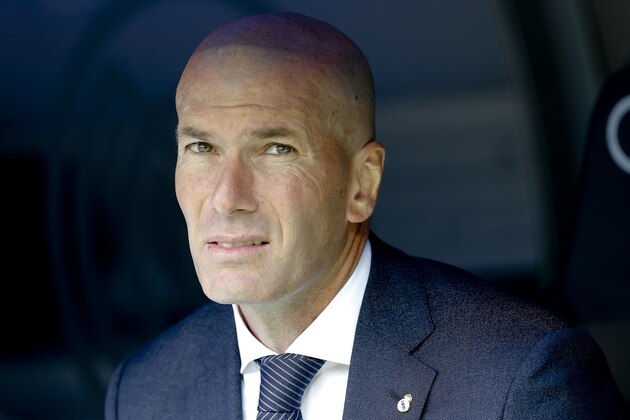 Real Madrid's coach Zinedine Zidane looks on prior to the start of a Spanish La Liga soccer match between Real Madrid and Eibar at the Santiago Bernabeu stadium in Madrid, Spain, Saturday April 6, 2019. (AP Photo/Paul White)