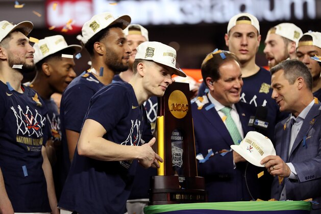 MINNEAPOLIS, MINNESOTA - APRIL 08:  Kyle Guy #5 of the Virginia Cavaliers celebrates with the trophy after his teams 85-77 win over the Texas Tech Red Raiders to win the 2019 NCAA men's Final Four National Championship game at U.S. Bank Stadium on April 08, 2019 in Minneapolis, Minnesota. (Photo by Streeter Lecka/Getty Images)
