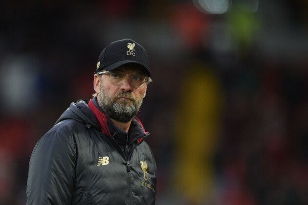 Liverpool's German manager Jurgen Klopp gestures before the English Premier League football match between Liverpool and Huddersfield at Anfield in Liverpool, north west England on April 26, 2019. (Photo by Oli SCARFF / AFP) / RESTRICTED TO EDITORIAL USE. No use with unauthorized audio, video, data, fixture lists, club/league logos or 'live' services. Online in-match use limited to 120 images. An additional 40 images may be used in extra time. No video emulation. Social media in-match use limited to 120 images. An additional 40 images may be used in extra time. No use in betting publications, games or single club/league/player publications. /         (Photo credit should read OLI SCARFF/AFP/Getty Images)