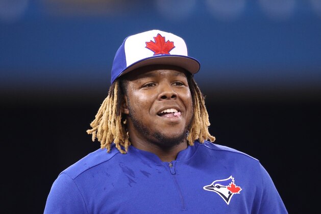 TORONTO, ON - APRIL 26: Vladimir Guerrero Jr. #27 of the Toronto Blue Jays smiles as he takes grounders at third base during batting practice prior to MLB game action against the Oakland Athletics at Rogers Centre on April 26, 2019 in Toronto, Canada. (Photo by Tom Szczerbowski/Getty Images)