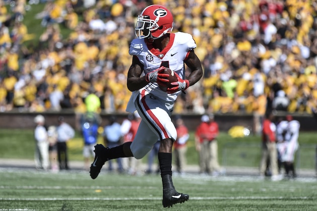 COLUMBIA, MO - SEPTEMBER 22: Wide receiver Mecole Hardman #4 of the Georgia Bulldogs runs for a touchdown pass against the Missouri Tigers in the fourth quarter at Memorial Stadium on September 22, 2018 in Columbia, Missouri. (Photo by Ed Zurga/Getty Images)