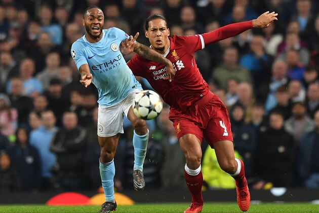 Manchester City's English midfielder Raheem Sterling (L) vies with Liverpool's Dutch defender Virgil van Dijk during the UEFA Champions League second leg quarter-final football match between Manchester City and Liverpool, at the Etihad Stadium in Manchester, north west England on April 10, 2018. / AFP PHOTO / Anthony Devlin        (Photo credit should read ANTHONY DEVLIN/AFP/Getty Images)