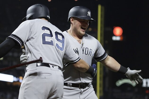 New York Yankees' Luke Voit, right, is congratulated by Gio Urshela (29) after hitting a two run home run off San Francisco Giants' Mark Melancon in the ninth inning of a baseball game Friday, April 26, 2019, in San Francisco. (AP Photo/Ben Margot)