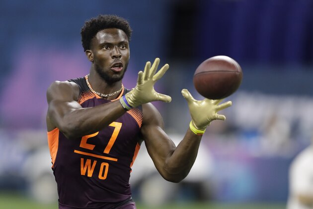 West Virginia wide receiver Gary Jennings runs a drill during the NFL football scouting combine, Saturday, March 2, 2019, in Indianapolis. (AP Photo/Darron Cummings)
