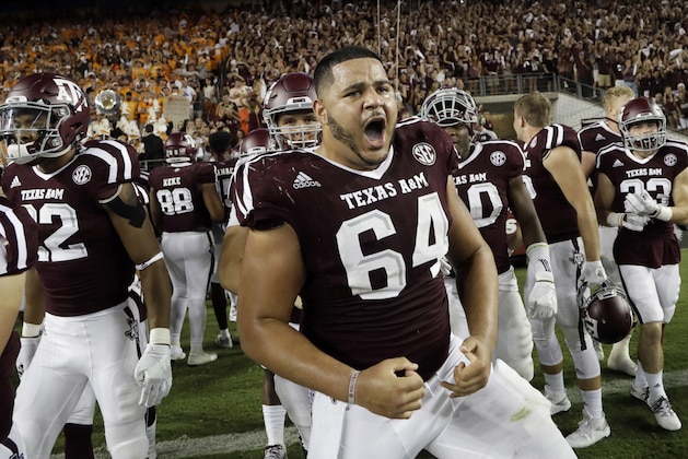 Texas A&M offensive lineman Erik McCoy (64) celebrates after beating Tennessee in an NCAA college football game Saturday, Oct. 8, 2016, in College Station, Texas. Texas A&M won 45-38 in overtime. (AP Photo/David J. Phillip)