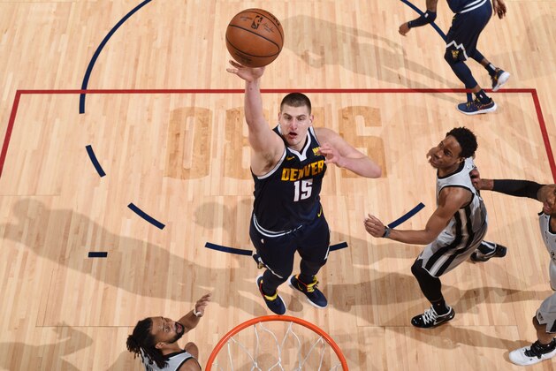 DENVER, CO - APRIL 27: Nikola Jokic #15 of the Denver Nuggets shoots the ball against the San Antonio Spurs during Game Seven of Round One of the 2019 NBA Playoffs on April 27, 2019 at the Pepsi Center in Denver, Colorado. NOTE TO USER: User expressly acknowledges and agrees that, by downloading and/or using this Photograph, user is consenting to the terms and conditions of the Getty Images License Agreement. Mandatory Copyright Notice: Copyright 2019 NBAE (Photo by Garrett Ellwood/NBAE via Getty Images)