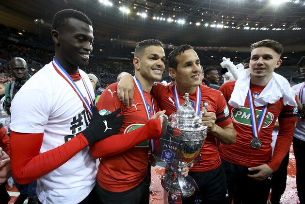 PARIS, FRANCE - APRIL 27: MBaye Niang, Hatem Ben Arfa, Mehdi Zeffane, Adrien Hunou of Stade Rennais celebrate their victory following the French Cup Final (Coupe de France) between Stade Rennais (Rennes) and Paris Saint-Germain (PSG) at Stade de France on April 27, 2019 in Saint-Denis near Paris, France. (Photo by Jean Catuffe/Getty Images)