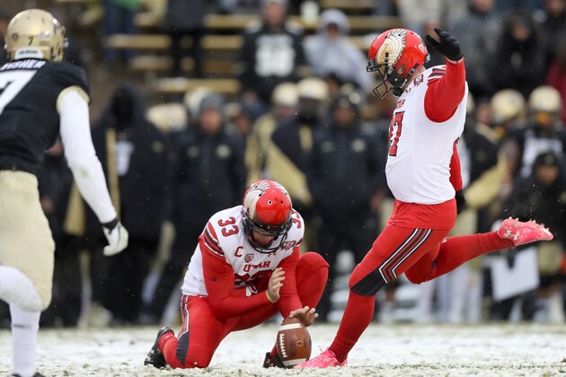 BOULDER, CO - NOVEMBER 17:  Mitch Wishnowsky #33 holds as Matt Gay #97 of the Utah Utes kicks a field goal against the Colorado Buffaloes in the fourth quarter at Folsom Field on November 17, 2018 in Boulder, Colorado.  (Photo by Matthew Stockman/Getty Images)