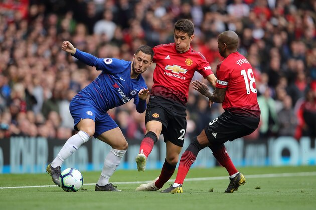 MANCHESTER, ENGLAND - APRIL 28: Eden Hazard of Chelsea and Ander Herrera and Ashley Young of Manchester United during the Premier League match between Manchester United and Chelsea FC at Old Trafford on April 28, 2019 in Manchester, United Kingdom. (Photo by Matthew Ashton - AMA/Getty Images)