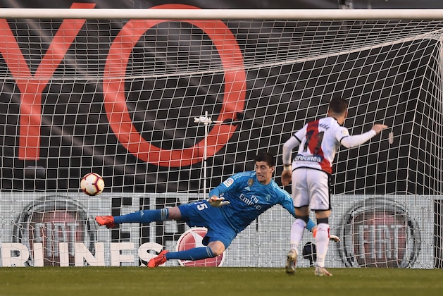 MADRID, SPAIN - APRIL 28: Thibaut Courtois of Real Madrid fails to save the penalty shot by Adri Embarba of Rayo Vallenco during the La Liga match between Rayo Vallecano de Madrid and Real Madrid CF at Campo de Futbol de Vallecas on April 28, 2019 in Madrid, Spain. (Photo by Denis Doyle/Getty Images)