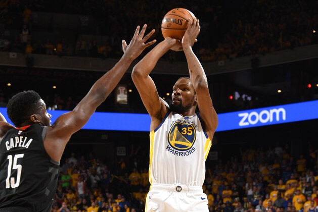 OAKLAND, CA - APRIL 28: Kevin Durant #35 of the Golden State Warriors shoots the ball against the Houston Rockets during the Western Conference Semi-Finals of the NBA Playoffs on April 28, 2019 at ORACLE Arena in Oakland, California. NOTE TO USER: User expressly acknowledges and agrees that, by downloading and or using this photograph, user is consenting to the terms and conditions of Getty Images License Agreement. Mandatory Copyright Notice: Copyright 2019 NBAE (Photo by Andrew D. Bernstein/NBAE via Getty Images)