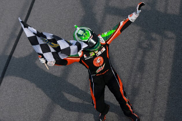 TALLADEGA, AL - APRIL 28:  Chase Elliott, driver of the #9 Mountain Dew/Little Caesar's Chevrolet, waves the checkered flag afrer winning the Monster Energy NASCAR Cup Series GEICO 500 at Talladega Superspeedway on April 28, 2019 in Talladega, Alabama.  (Photo by Sean Gardner/Getty Images)