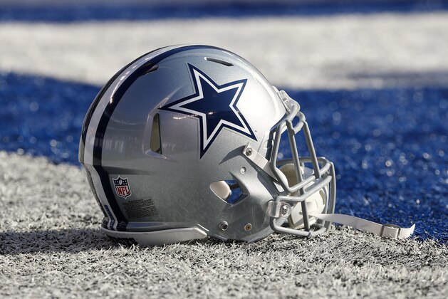A Dallas Cowboys helmet is seen on the field before an NFL football game against the New York Giants at MetLife Stadium in East Rutherford, NJ, Sunday, Dec. 10, 2017. (Winslow Townson/AP Images for Panini)