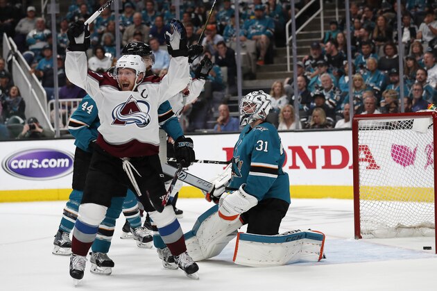 Colorado Avalanche's Gabriel Landeskog (92) celebrates a goal against San Jose Sharks goaltender Martin Jones (31) by teammate Tyson Barrie (not shown) in the second period of Game 2 of an NHL hockey second-round playoff series at the SAP Center in San Jose, Calif., on Sunday, April 28, 2019. (AP Photo/Josie Lepe)