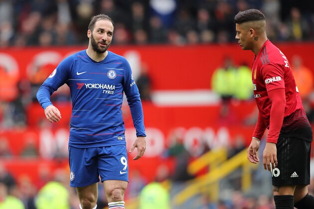 MANCHESTER, ENGLAND - APRIL 28: Gonzalo Higuain of Chelse confronts Marcos Rojo of Manchester United after his tackle on  Willian of Chelsea which resulted him receiving a yellow card  during the Premier League match between Manchester United and Chelsea FC at Old Trafford on April 28, 2019 in Manchester, United Kingdom. (Photo by Matthew Ashton - AMA/Getty Images)