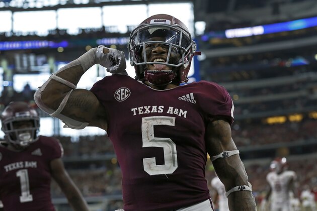 Texas A&M running back Trayveon Williams (5) celebrates after scoring a touchdown in the second half of an NCAA college football game against the Arkansas Razorbacks, Saturday, Sept. 29, 2018, in Arlington, Texas. (AP Photo/Roger Steinman)