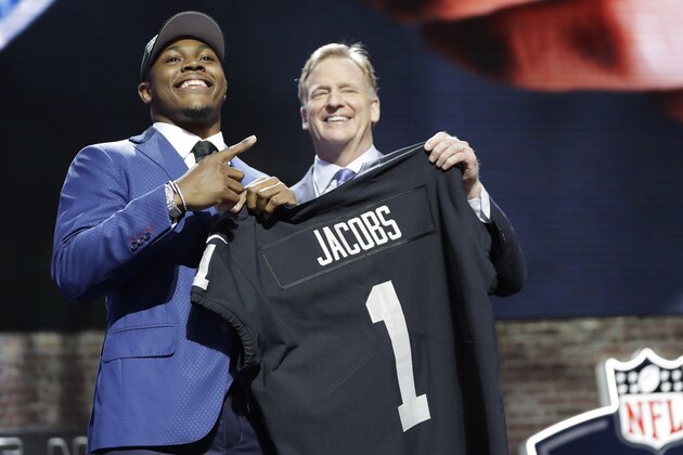 Alabama running back Josh Jacobs poses with NFL Commissioner Roger Goodell after the Oakland Raiders selected Jacobs in the first round at the NFL football draft, Thursday, April 25, 2019, in Nashville, Tenn.(AP Photo/Mark Humphrey)