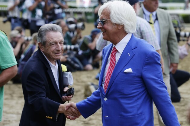 Justify's trainer Bob Baffert is congratulated after Justify won the 150th running of the Belmont Stakes horse race and the Triple Crown, Saturday, June 9, 2018, in Elmont, N.Y. (AP Photo/Frank Franklin II)